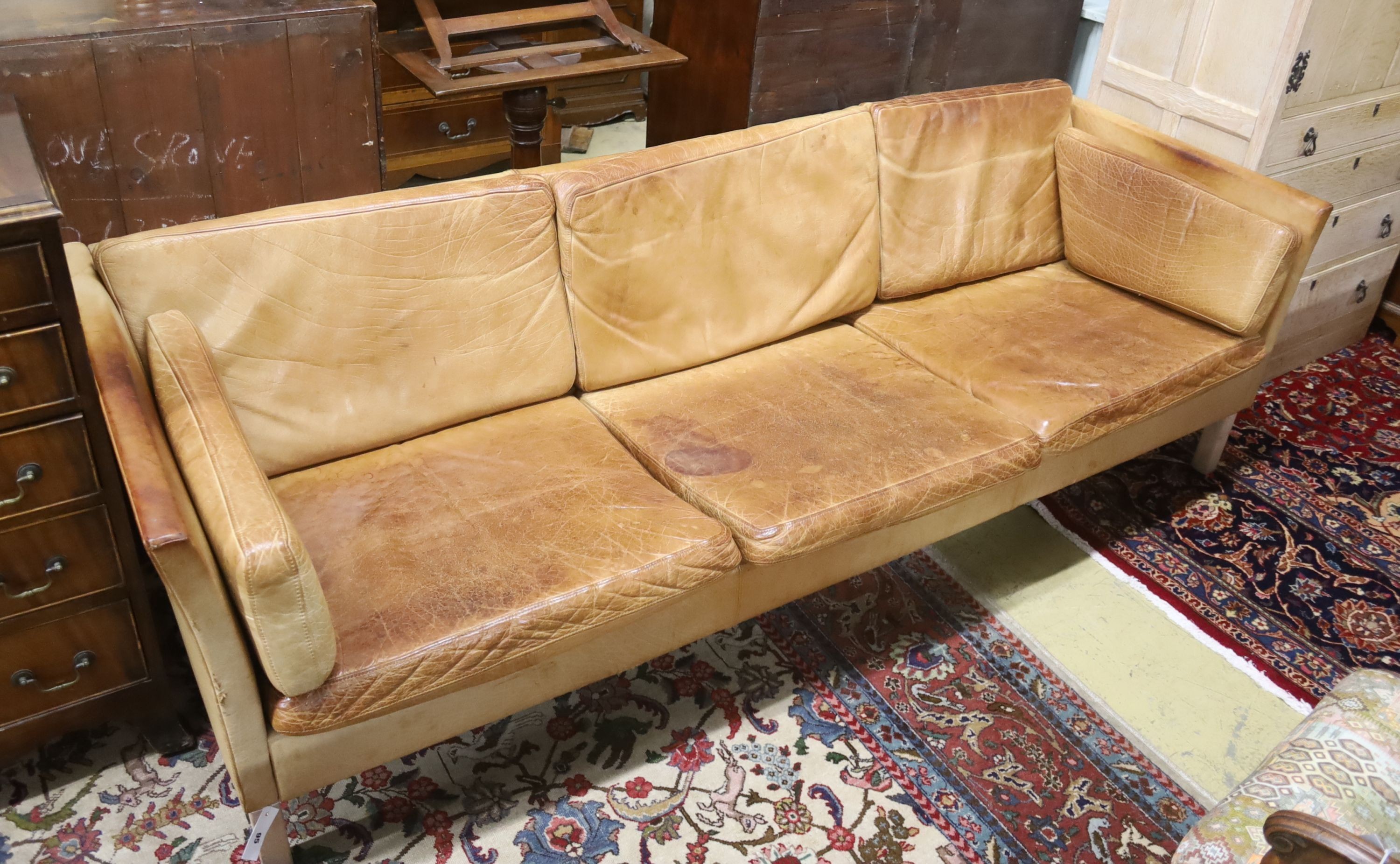 A Danish Borge Mogensen style tan leather three seater sofa, length 218cm, depth 78cm, height 66cm